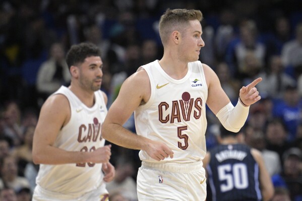 Sam Merrill scores 26 Cavs ease past Magic 126 99 for 8th